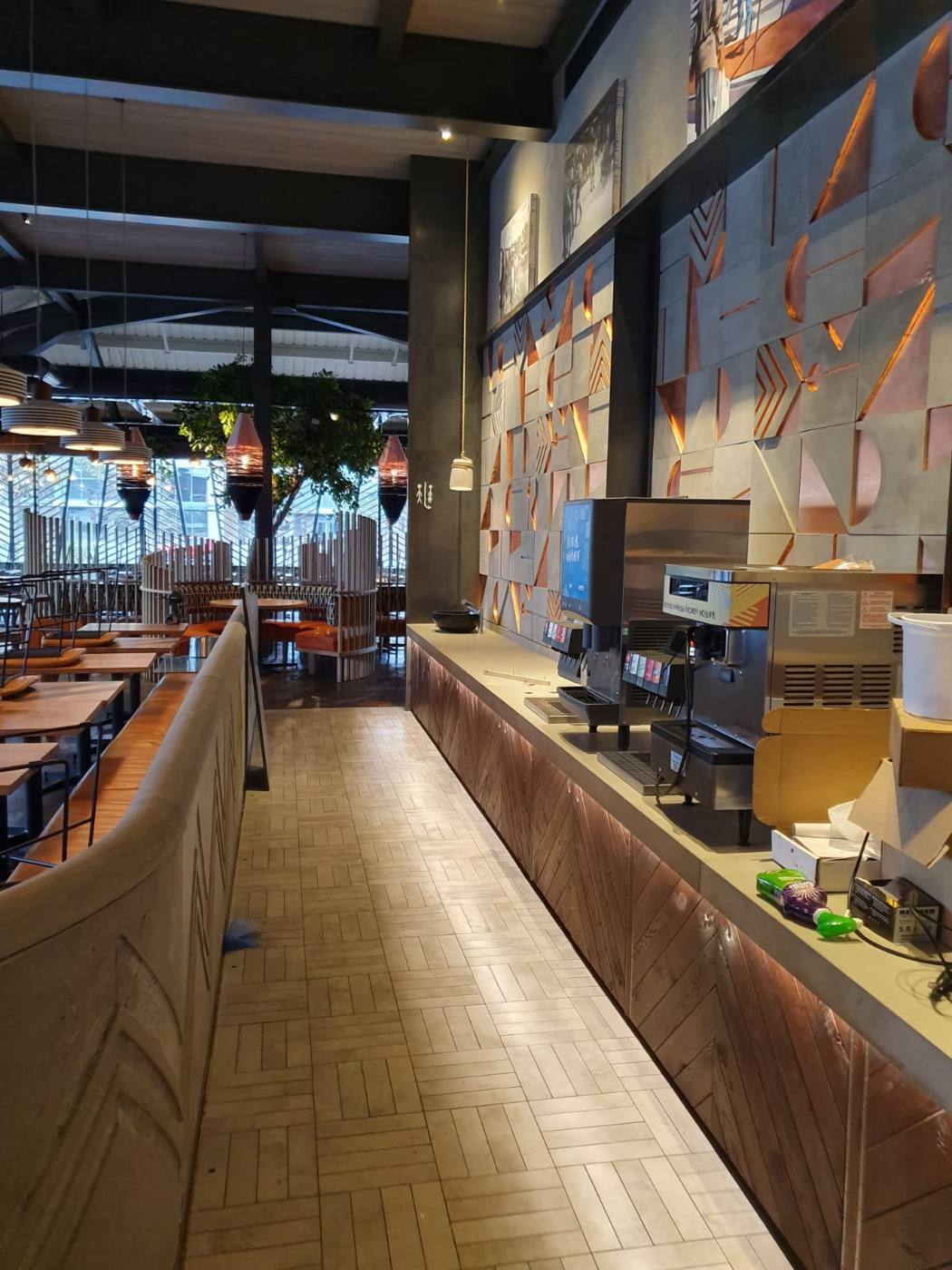Cleaned restaurant walkway alongside the bar and kitchen pass