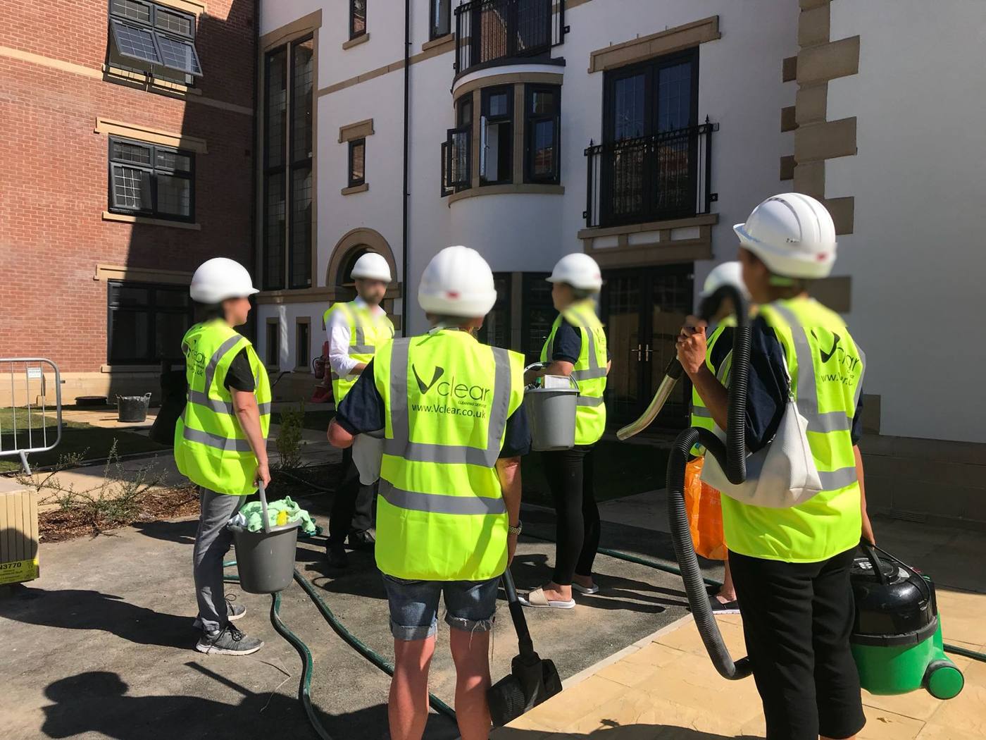 Vclear cleaning team in high-vis on site at a residential development